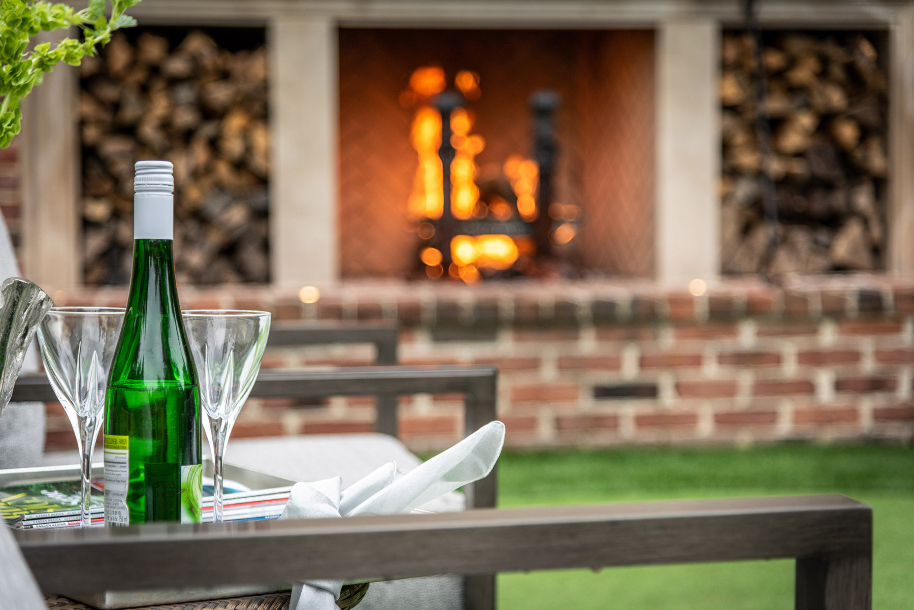 Detail photo of fireplace and sitting area on the putting green.