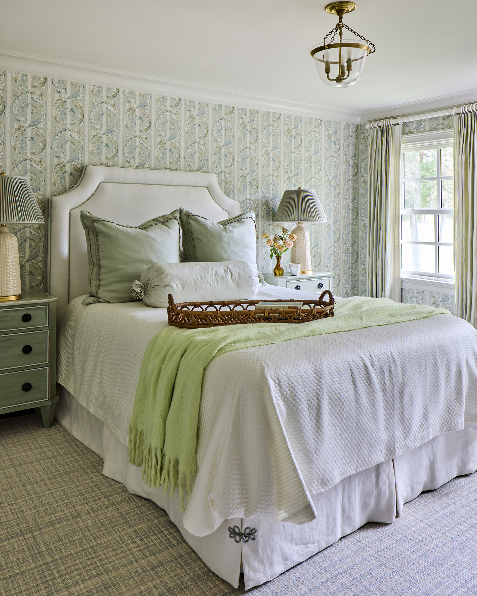 Patterned wallpaper accent in Greystone home renovation upstairs guestroom