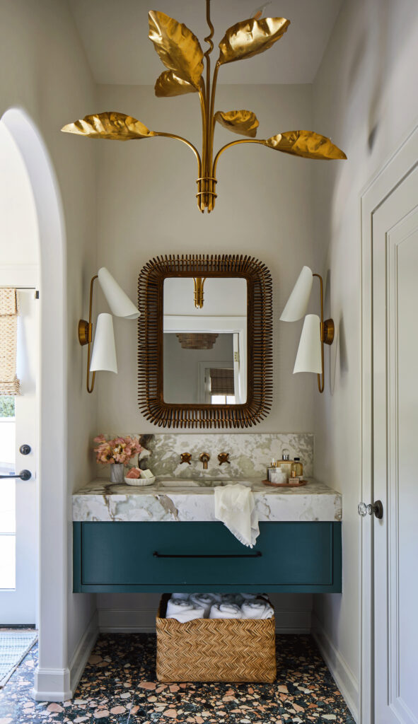  Marianne Strong powder room with terrazzo flooring and countertops from Triton Stone. Chandelier and sconces from Visual Comfort in dramatic Homewood interior.