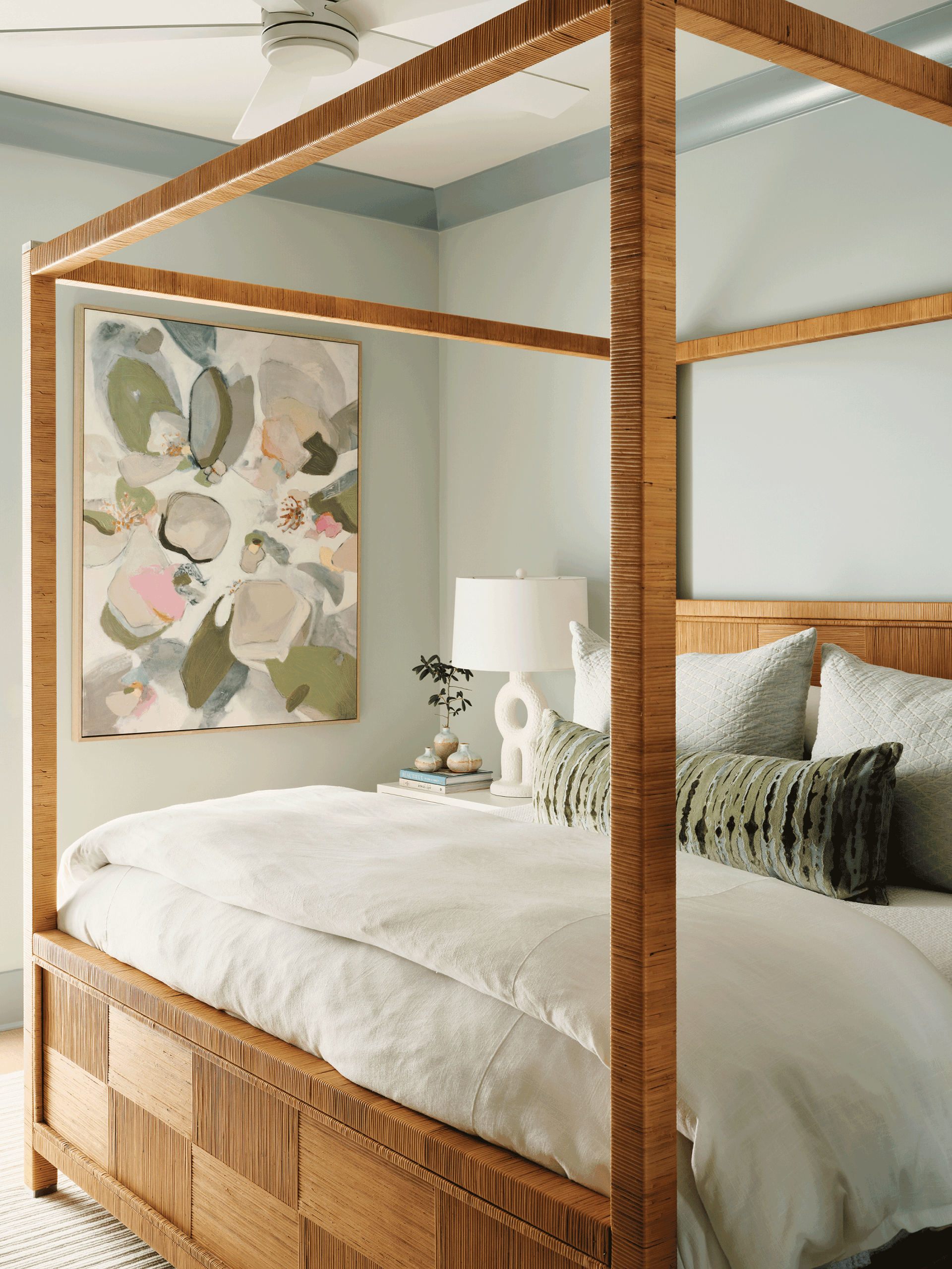 Sophisticated primary bedroom featuring a sage green color-drenched palette, providing a private sanctuary when sharing a vacation home.