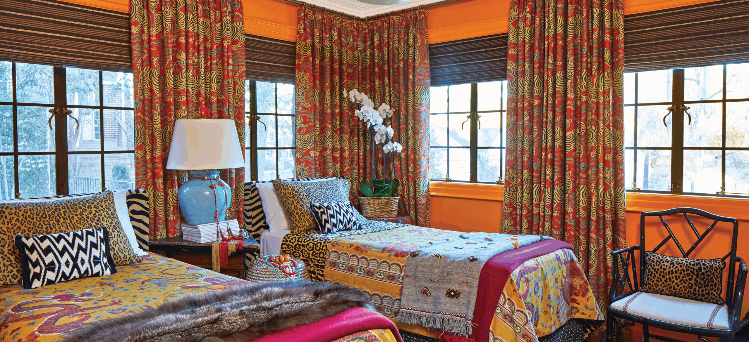 Colorful saffron guest bedroom in Birmingham designer home