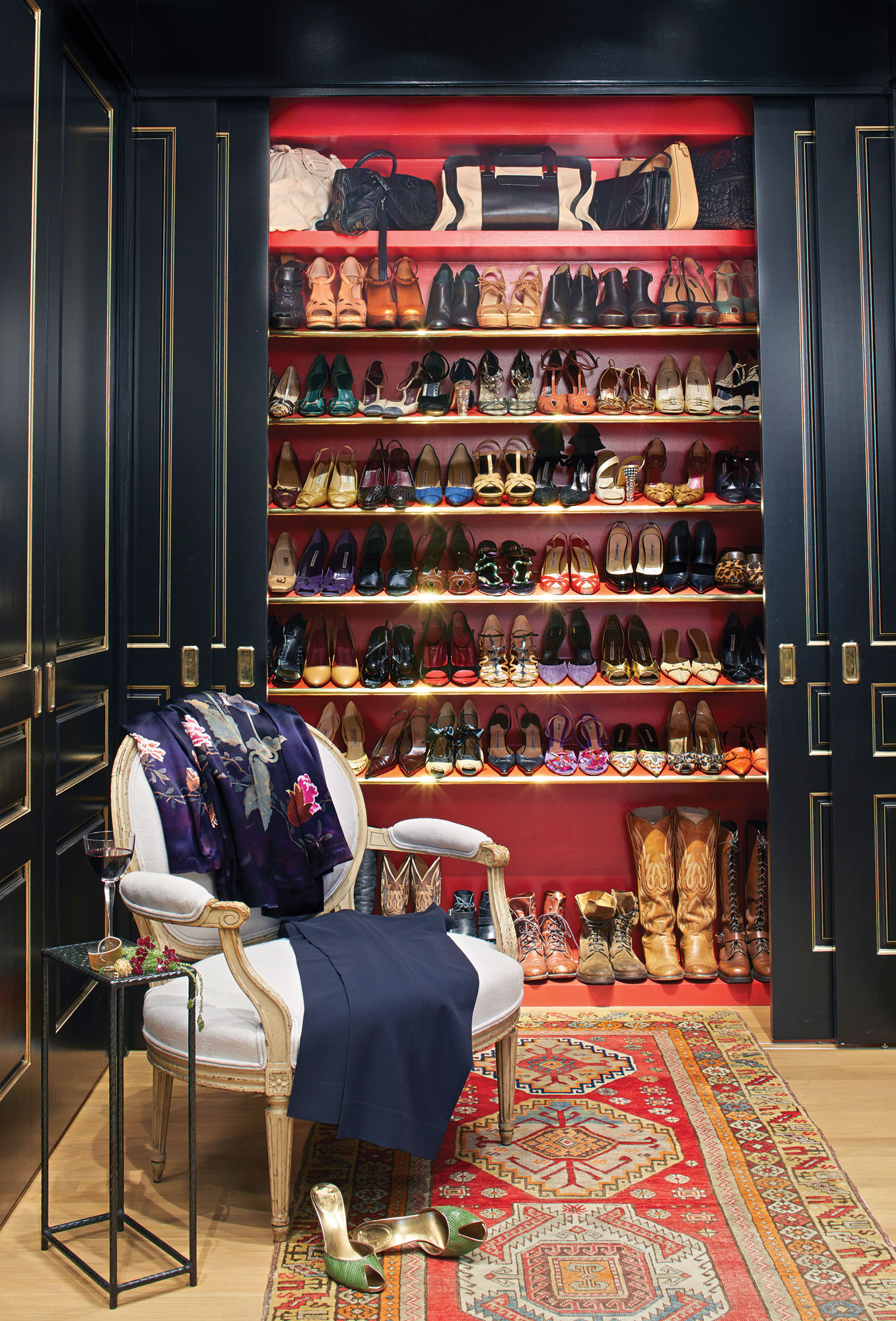 Custom closet with red interior in Birmingham luxury home