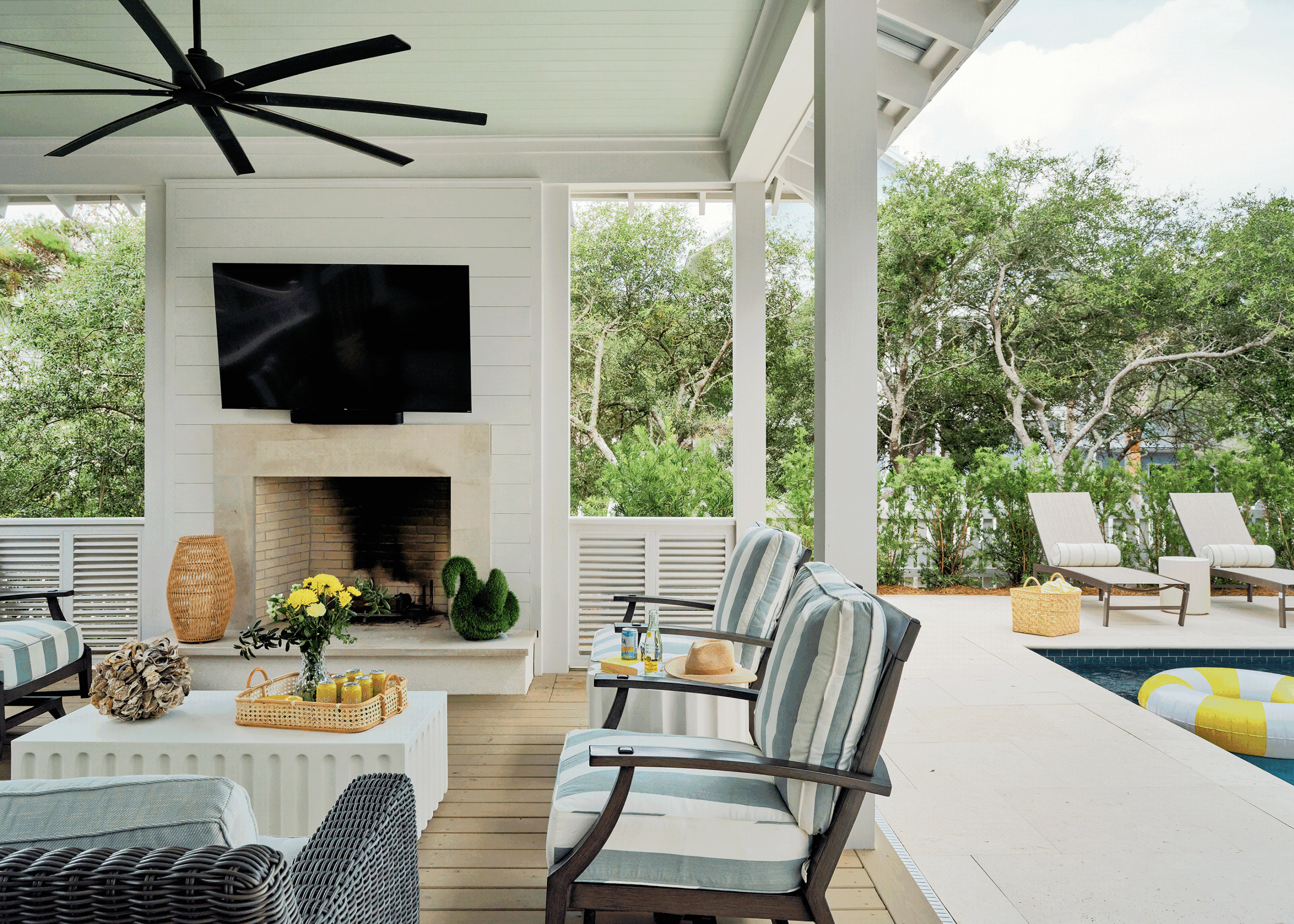 Seamless transition from a covered lounge to a private pool deck, highlighting the outdoor amenities enjoyed when sharing a vacation home.