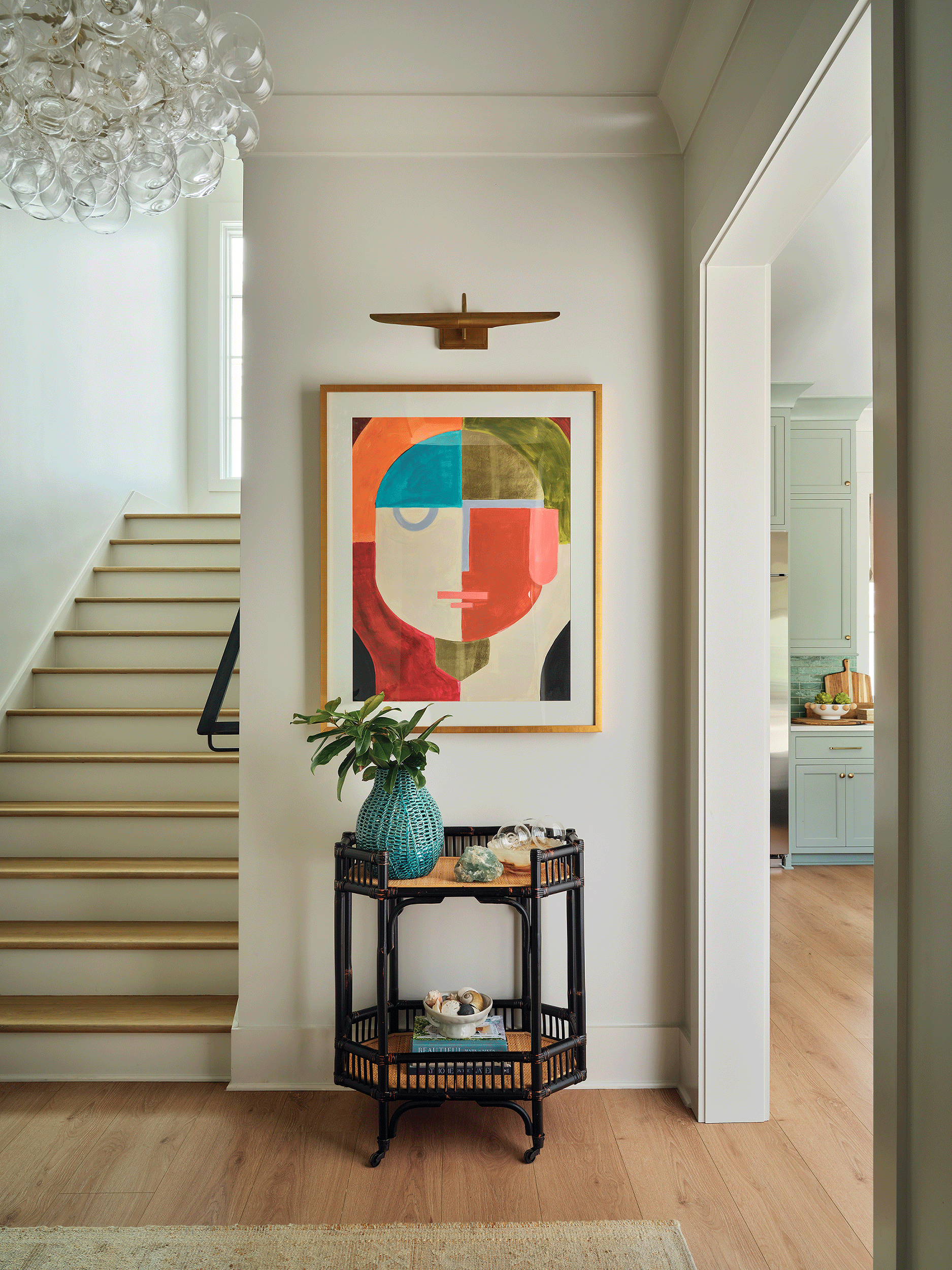 Modern beach house entryway with stairs and elevator access for multi-generational living.