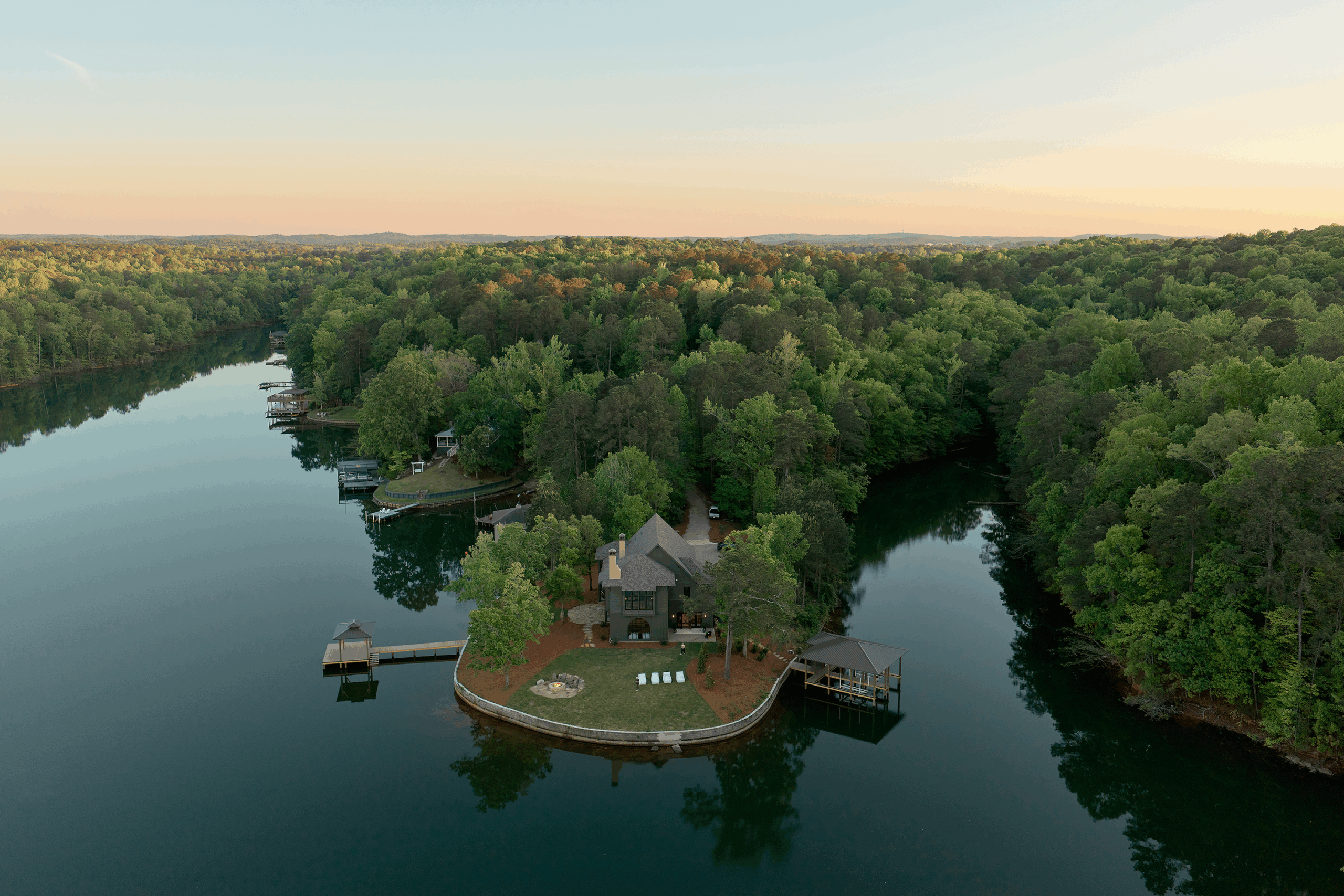 Set on a coveted point at Lake Martin, the home enjoys water views on three sides.