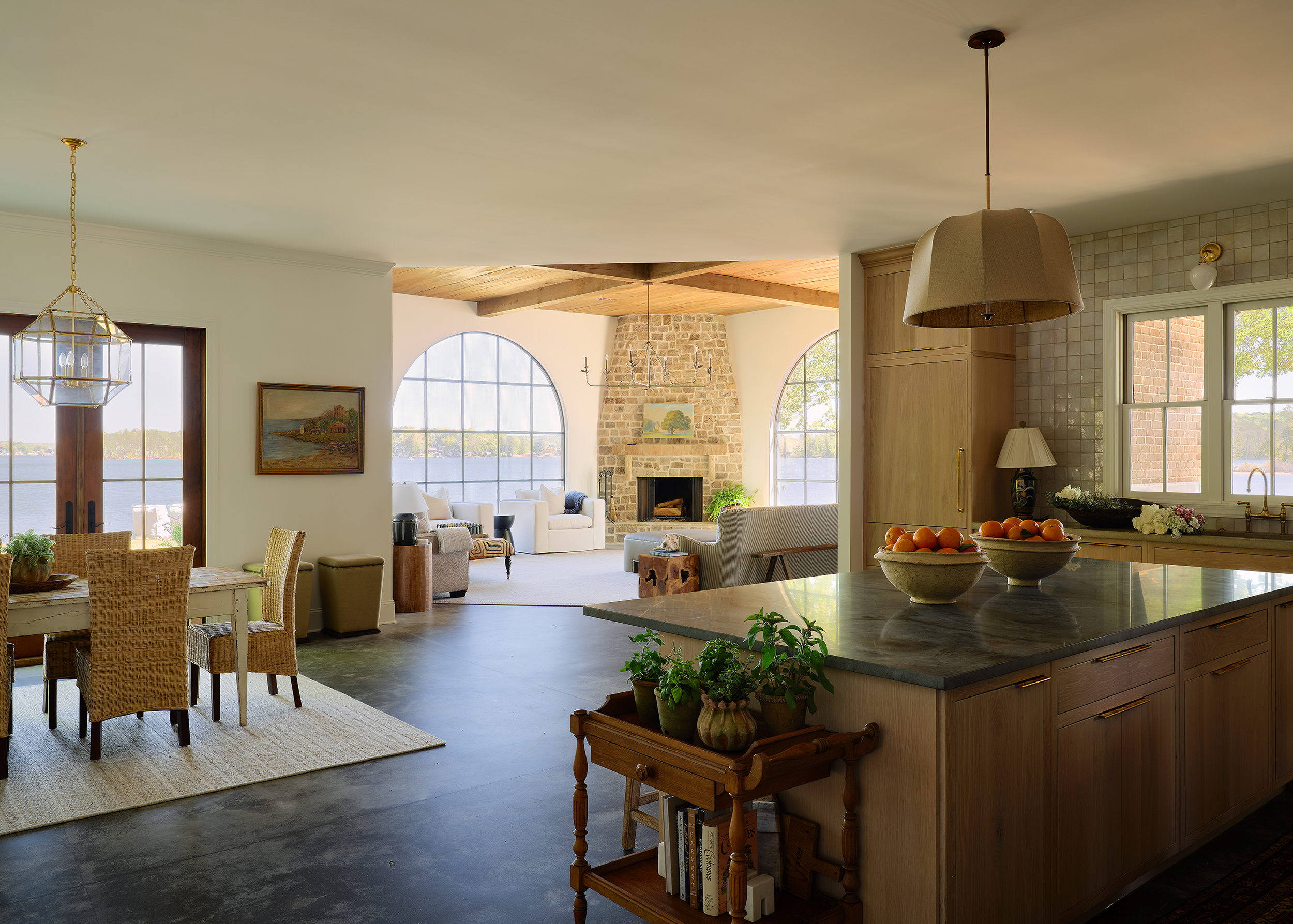 Lake Martin kitchen featuring custom white oak cabinetry, quartzite countertops, and polished concrete floors.