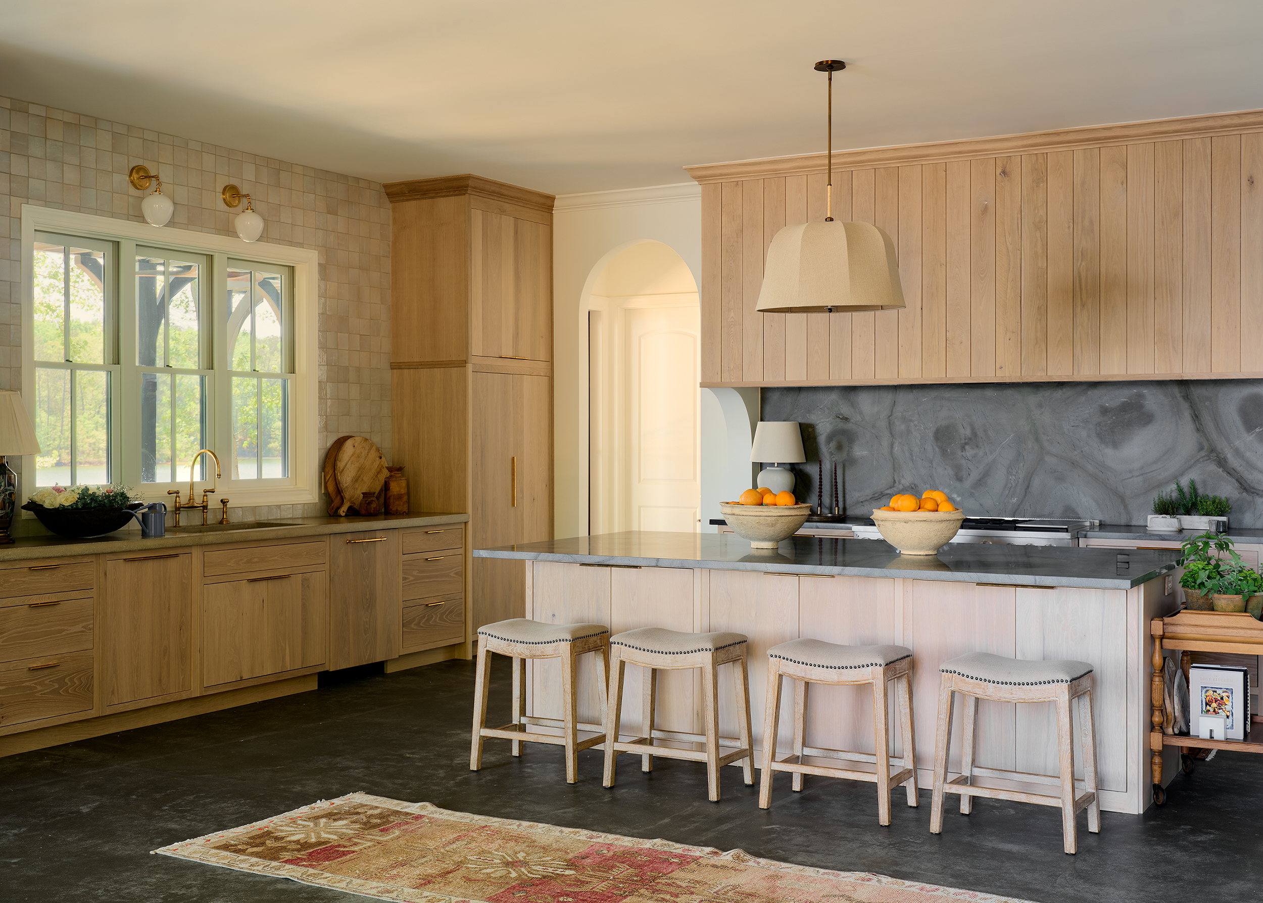 This Lake Martin kitchen's natural palette is defined by contrasts,
